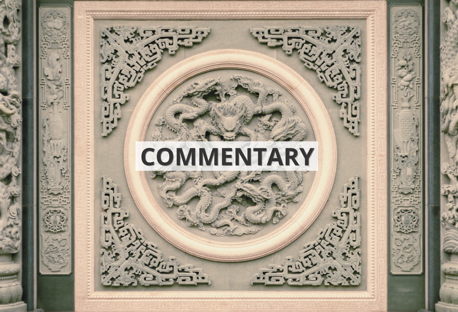 A relief depicting a dragon in East Asian style with the inscription 'commentary'