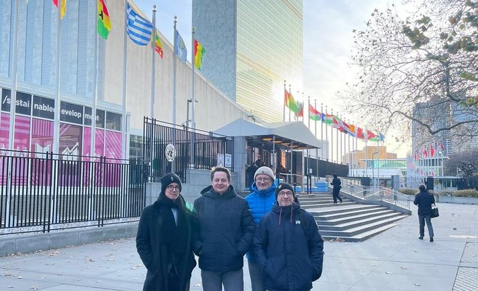 Members of the research team in front of the United Nations Headquarters in New York