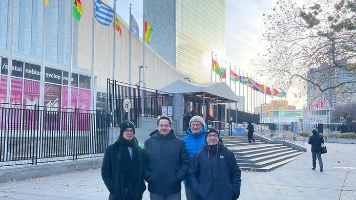 Members of the research team in front of the United Nations Headquarters in New York