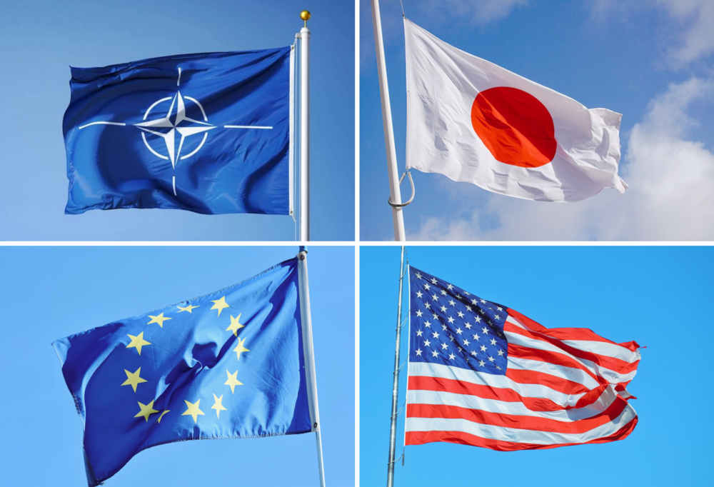 W lewym górnym rogu flaga NATO, w lewym dolnym rogu flaga Unii Europejskiej, w prawym górnym rogu flaga Japonii, w prawym dolnym rogu flaga Stanów Zjednoczonych/In the upper left corner the NATO flag, in the lower left corner the European Union flag, in the upper right corner the flag of Japan, in the lower right corner the flag of the United States