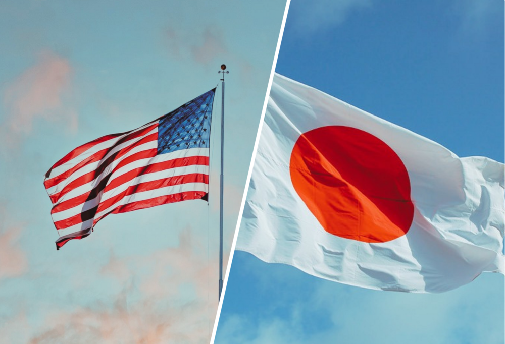 Po lewej stronie powiewająca flaga Stanów Zjednoczonych, a po prawej stronie powiewająca flaga Japonii/On the left side, the waving flag of the United States, and on the right side, the waving flag of Japan 