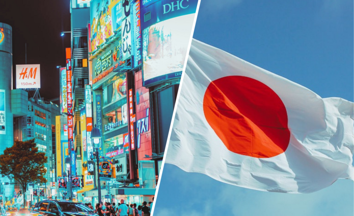 Japońskie miasto wieczorem i flaga Japonii