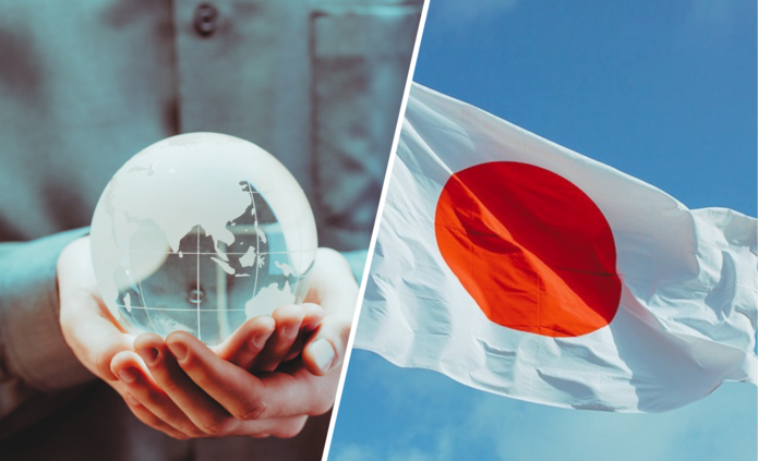 Planeta Ziemia w złożonych rękach i flaga Japonii