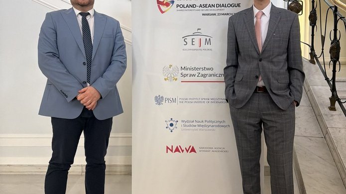 Dr. Zaręba and Dr. Chatys by the banner of the Poland–ASEAN Dialogue event