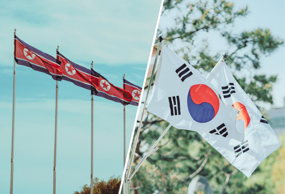 Po lewej stronie cztery flagi Korei Północnej, a po prawej stronie dwie flagi Korei Południowej/Four North Korean flags on the left and two South Korean flags on the right